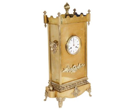 A 19th Century French Brass Mantel Clock:With stepped form top and floral finials and large flame finial to centre, goats hea