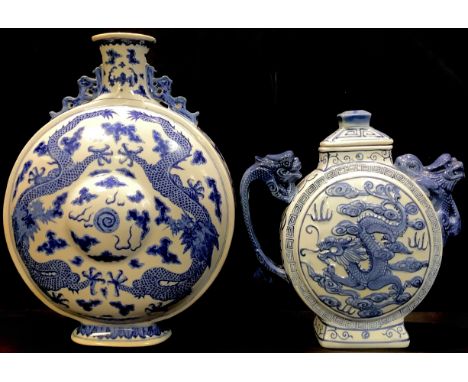 A Chinese blue and white moon flask, painted with dragons chasing the flaming pearl, dragon handles, 26.5cm, printed characte