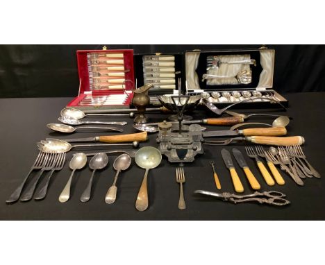 An EPNS ladle, cased flatware, fruit spoons, dessert knives and forks; an EPNS jug; a pair of berry spoons; a cruet set on tr