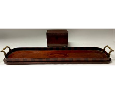A Georgian mahogany rectangular tea caddy; a mahogany elongated serving tray, inlaid with shell patera, brass handles, 60cm l