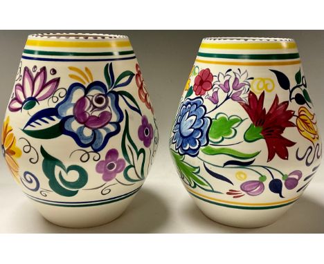 A pair of Poole ovoid vases, hand painted with large flower heads in colourful shades, 21cm, printed dolphin mark in blue 