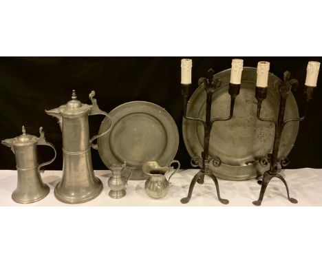 An 18th century pewter charger, 42cm diam, London touch marks;  another, smaller, 29.5cm diam, London touch marks;  continent