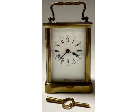 A late 19th century lacquered brass carriage timepiece, white enamel dial, Roman numerals, five glass case, 14.5cm high over 