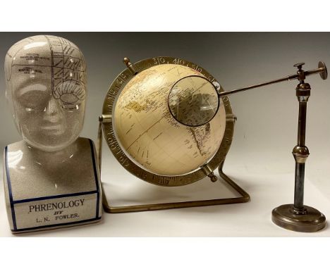 A replica phrenology bust, after L.N. Fowler, 29cm high; an articulated library magnifying glass; a brass mounted globe (3) 