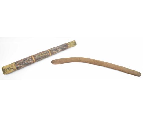 An Aboriginal stick/pole with painted decoration, length 60cm and a simple wooden boomerang, 67cm.