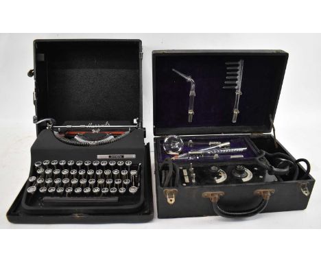 A Harrods Invicta Typewriter and a vintage electrotherapy kit (2).