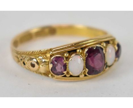 A 15ct yellow gold ruby and opal set ring, size M, approx. 1.9g.