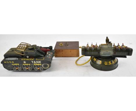 A tinplate M556 tank and a US Army M.35 rocket launcher.