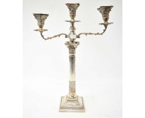 A George V hallmarked silver three branch candelabrum, with engraved presentation inscription, London 1928, height 47cm.