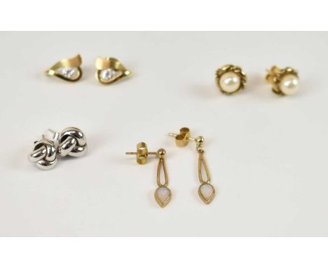 A pair of 9ct white gold earrings, a pair of 9ct yellow gold seed pearl set earrings, a pair of 9ct yellow gold earrings set 