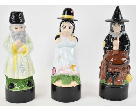Three ceramic novelty decanters, marked Angie Ward to base, height 34cm.