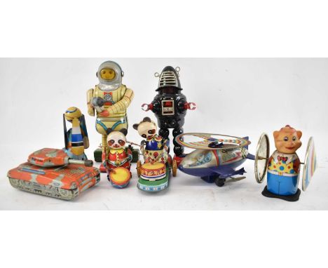 A group of tinplate toys, to include tinplate robot, two teddy bear drummers, tank, spaceship model and Robbie Robot.