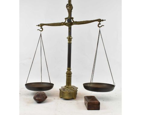 A set of brass balance scales with weights and a further cased set of weights, height of scales 94cm.