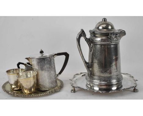 A large Reed &amp; Barton silver plated insulated iced water jug, two salvers, a stylish three piece coffee service and a pai