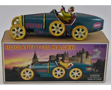 A Bugatti T-35 Racer tinplate car, boxed.