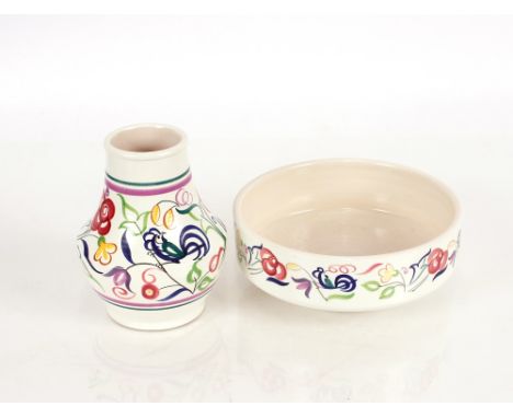 A Poole pottery floral decorated bowl,  and baluster vase