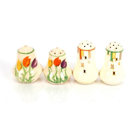 A pair of Art Deco pepper pots in the Clarice Cliff style, having stylised orange, black and yellow floral decoration, 7cm hi