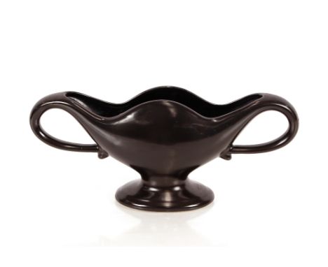 A black Constance Spry style pottery twin handle mantelpiece vase, 30cm long