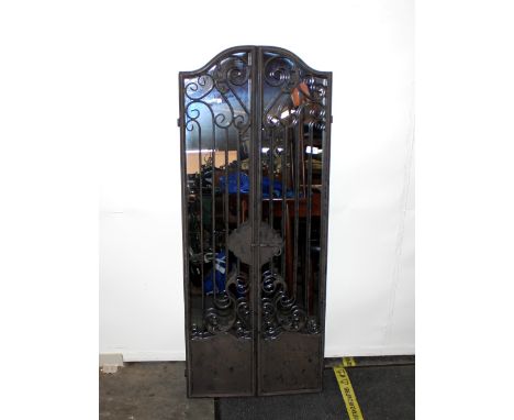An iron garden gate mirror, 52cm wide x 129cm high 