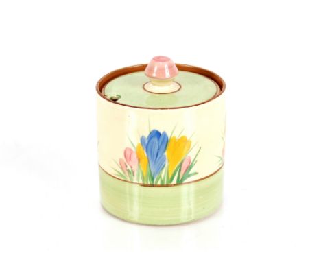 A Clarice Cliff, "Crocus" pattern preserve pot and cover, 8cm dia. x 9cm high 