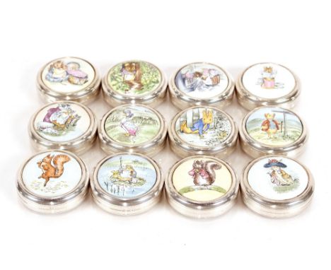 Twelve silver and enamel limited edition circular boxes, decorated Beatrix Potter characters