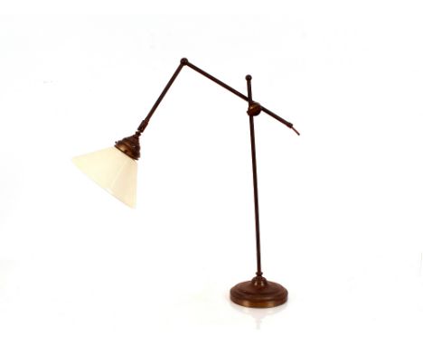 A Benson style brass mounted adjustable angle poise type lamp, with opaque glass shade 