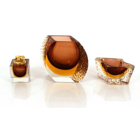 A three piece amber and smoked Art Glass lighter, ash tray and bowl