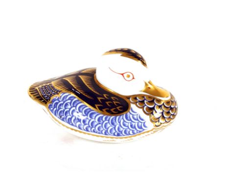 A Royal Crown Derby duck paperweight complete with gold coloured button