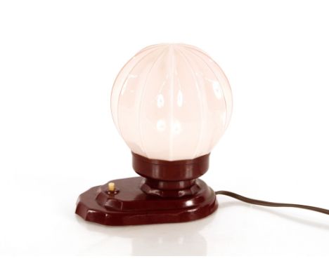 A Bakelite bedside lamp with opaque glass shade, 18cm high 