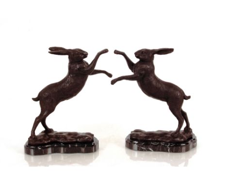 A pair of bronze boxing hare figures, 32cm high 