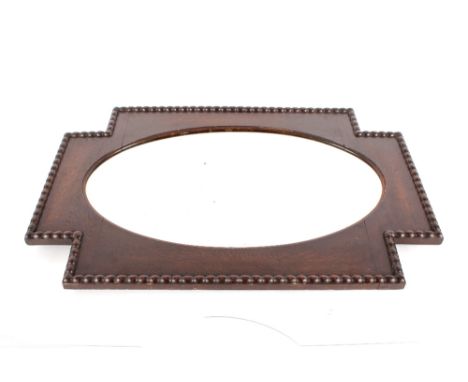 A large early 20th Century oak framed oval bevel edged wall mirror, 92cm x 60cm 