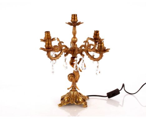 A brass five branch table lamp in the form of a mermaid, hung with faceted glass drops, 40cm high