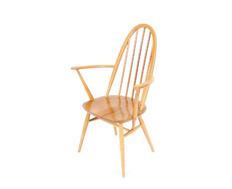 A set of six Ercol stick back dining chairs, four standard, two elbows