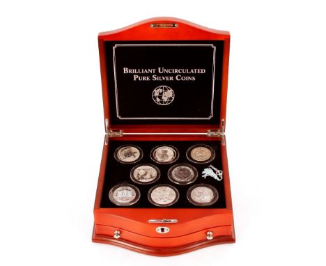 The World Brilliant Uncirculated Purist Silver coin collection with certificate in wooden fitted case