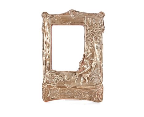 An Edwardian silver Hiawatha decorated photograph frame, inscribed with verse "Feed The Fire Of Friendship And The Winds Will