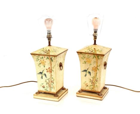 A pair of Toleware style Regency design decorative table lamp, with floral decoration and lion ring mask handles and claw fee