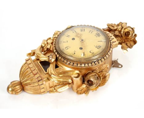 A gilt Cartell style wall clock 