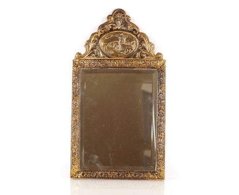 A brass Repoussé decorated bevelled wall mirror, 50cm x 27cm 
