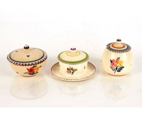 A Poole pottery preserve stand and cover with floral decoration; a Carter Stabler Adams Ltd. Poole pottery bowl and cover wit
