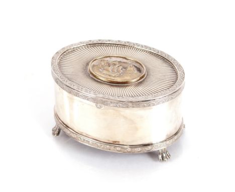 A silver and silver gilt decorated oval music box, the hinged lid with a panel of three ships sailing