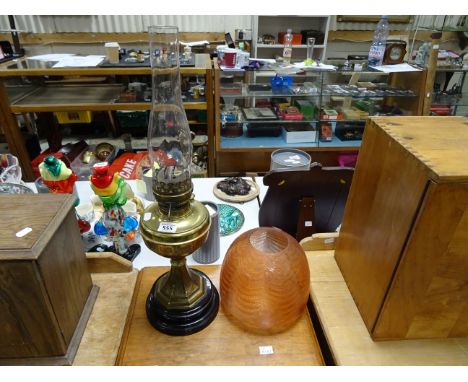 Brass oil lamp with etched peach glass shade