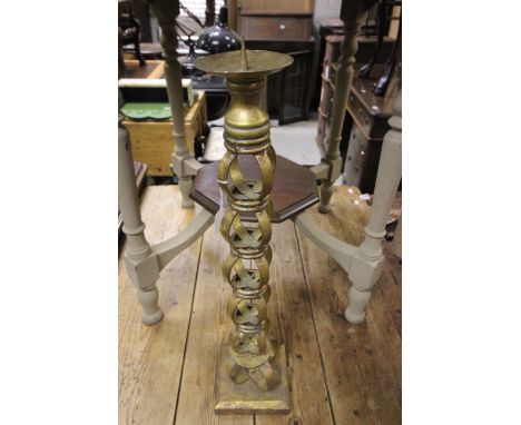 A decorative gilt candlestick  