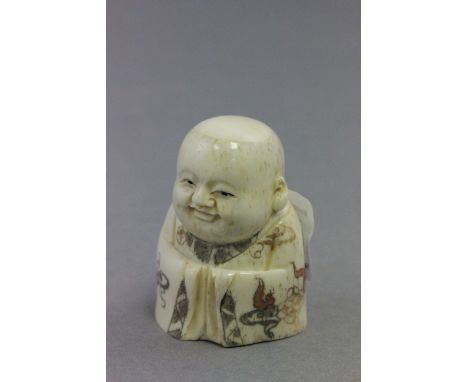 Signed oxbone netsuke of a Buddha