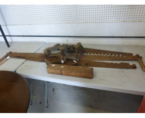 Group of antique tools to include two twin handled saws one other to cobblers lasts, a plane and two large clamps
