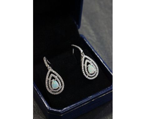 Pair of silver CZ and pear shaped opal drop earrings