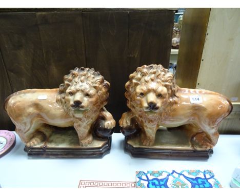 A pair of decorative ceramic lions