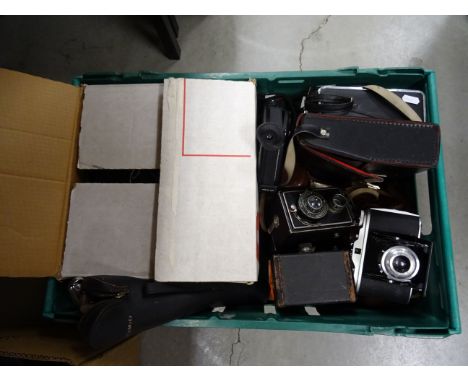 Photography slide projector in box along with a selection of antique cameras including film and cine