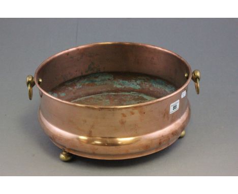 Copper Circular Jardiniere Bowl / Planter with brass ring handles and three brass ball feet