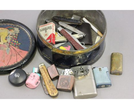 A collection of lighter, penknives and other items 