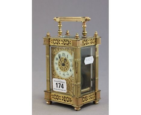 20th C gilt carriage clock with white enamelled dial and black numerals